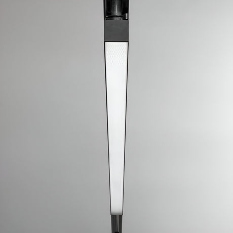 Close-up of the Dune UGR 3-Phase LED Linear Track Light, featuring a modern, minimalist design with a triangular shape and frosted glass diffuser, mounted against a plain gray background. Its sleek lines and monochromatic black color seamlessly integrate into any 3-Phase Track System.