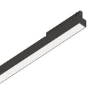 The Dune UGR 3-Phase LED Linear Track Light 28W 3000K - Black, measuring 1065mm, is elegantly placed diagonally against a white background. It emits a bright, even glow through its textured diffuser and is optimized for efficiency with its 3-phase track system.