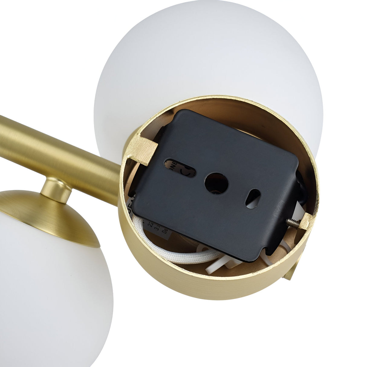 Close-up of a minimalist lighting fixture with a brass finish and two white globe-shaped lamps. The internal wiring and mounting bracket are visible, showcasing the assembly components of the Solana 3 Light Ceiling & Wall Light - White.