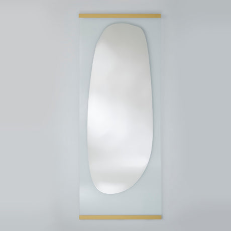 Full length leaning mirror with an organic silvered shape on clear glass, held by slim gold bars at the top and bottom.