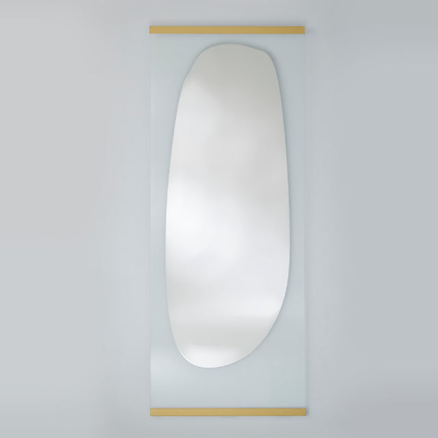 Full length leaning mirror with an organic silvered shape on clear glass, held by slim gold bars at the top and bottom.