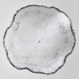 Arbo Dark frameless wall mirror with irregular tree ring-effect printed glass face and dark uneven edge, shown on a plain white background.