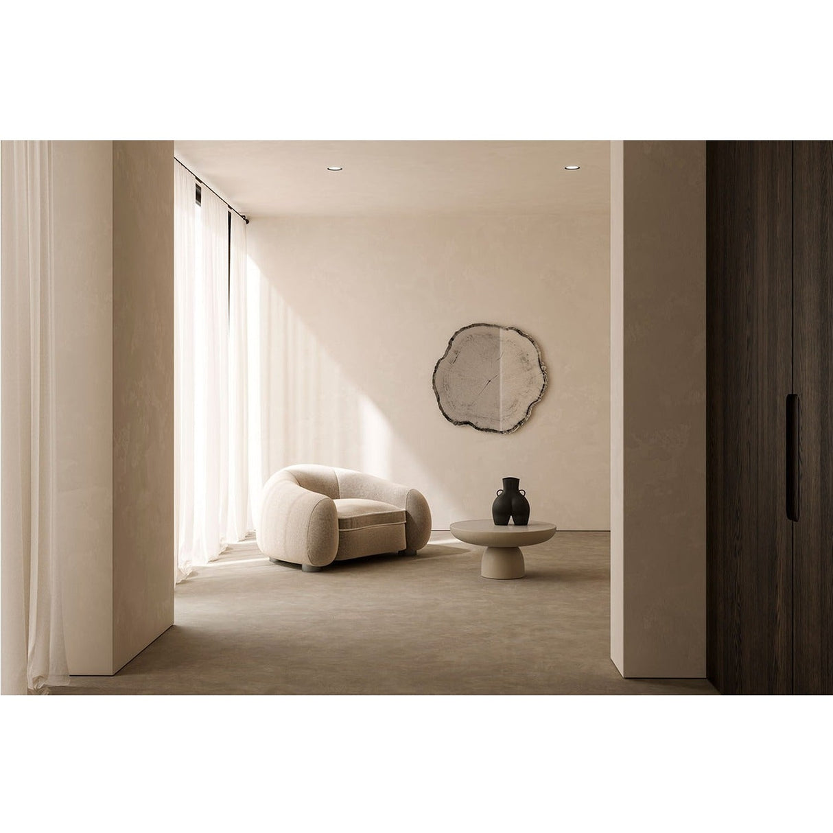 Arbo Dark Irregular Printed Glass Wall Mirror with a frameless, tree-ring inspired shape in dark tones, mounted above a bouclé armchair in a neutral living room.