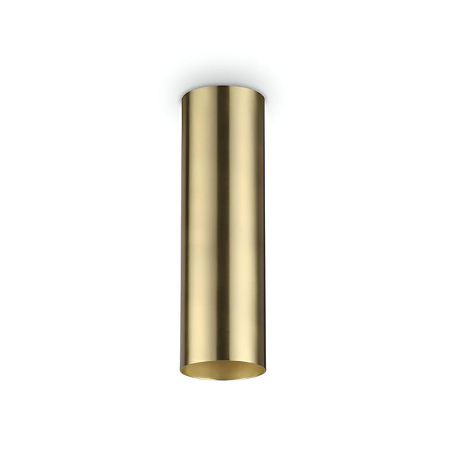 The Noctis Ceiling Light - Brass, 20cm showcases a sleek cylindrical design in satin brass, set against a plain white background. Its smooth reflective finish and modern, minimalist style make it a standout piece.