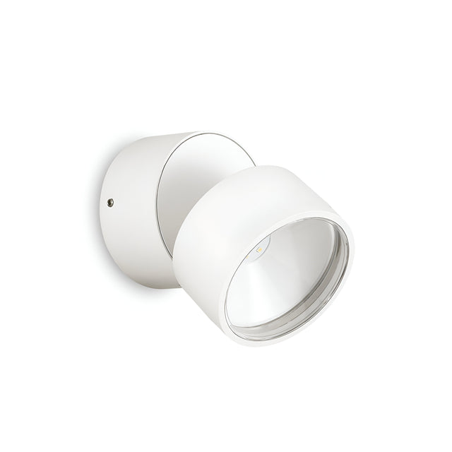 Illuminate your space with the energy-efficient Arcane Round Outdoor LED Single Spotlight in white. Crafted from powder-coated aluminum, its modern, sleek cylindrical design is precisely angled upward, making it an ideal choice for outdoor lighting solutions.