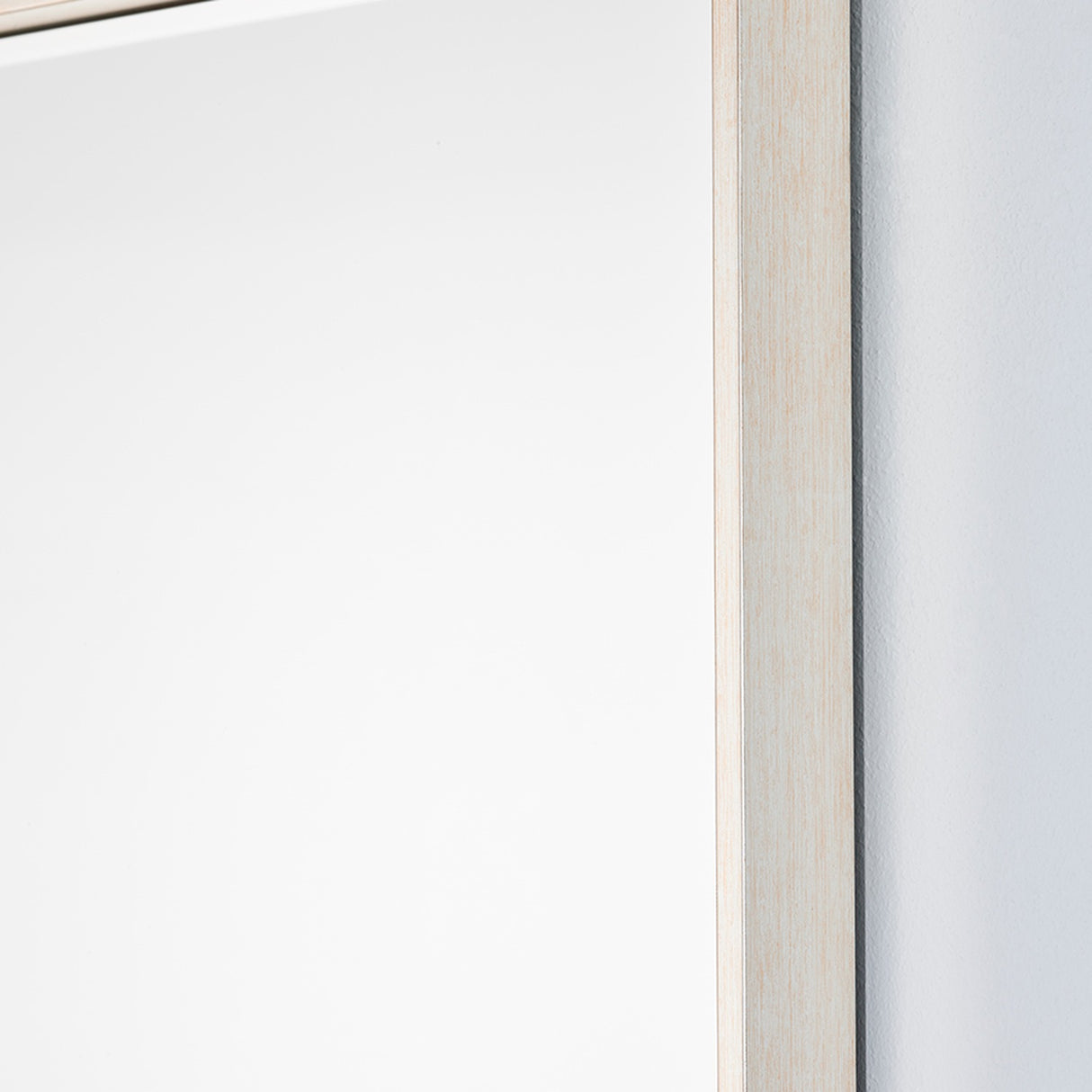 Close-up of the Soho Silver Slim Framed Rectangular Wall Mirror 121cm, showing the narrow squared silver frame edge against a plain light background.