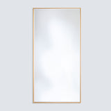 Soho Gold Slim Framed Full Length Mirror, rectangular with a narrow flat gold frame, mounted on a plain light grey wall.