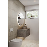 Brio Clear Round LED IP44 Bathroom Mirror, frameless circular design with backlit glow, mounted above a grey stone washbasin unit in a modern bathroom.