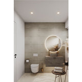 Brio Clear Round LED IP44 Bathroom Mirror, frameless round design with backlit glow, mounted above a marble vanity basin in a modern bathroom setting.