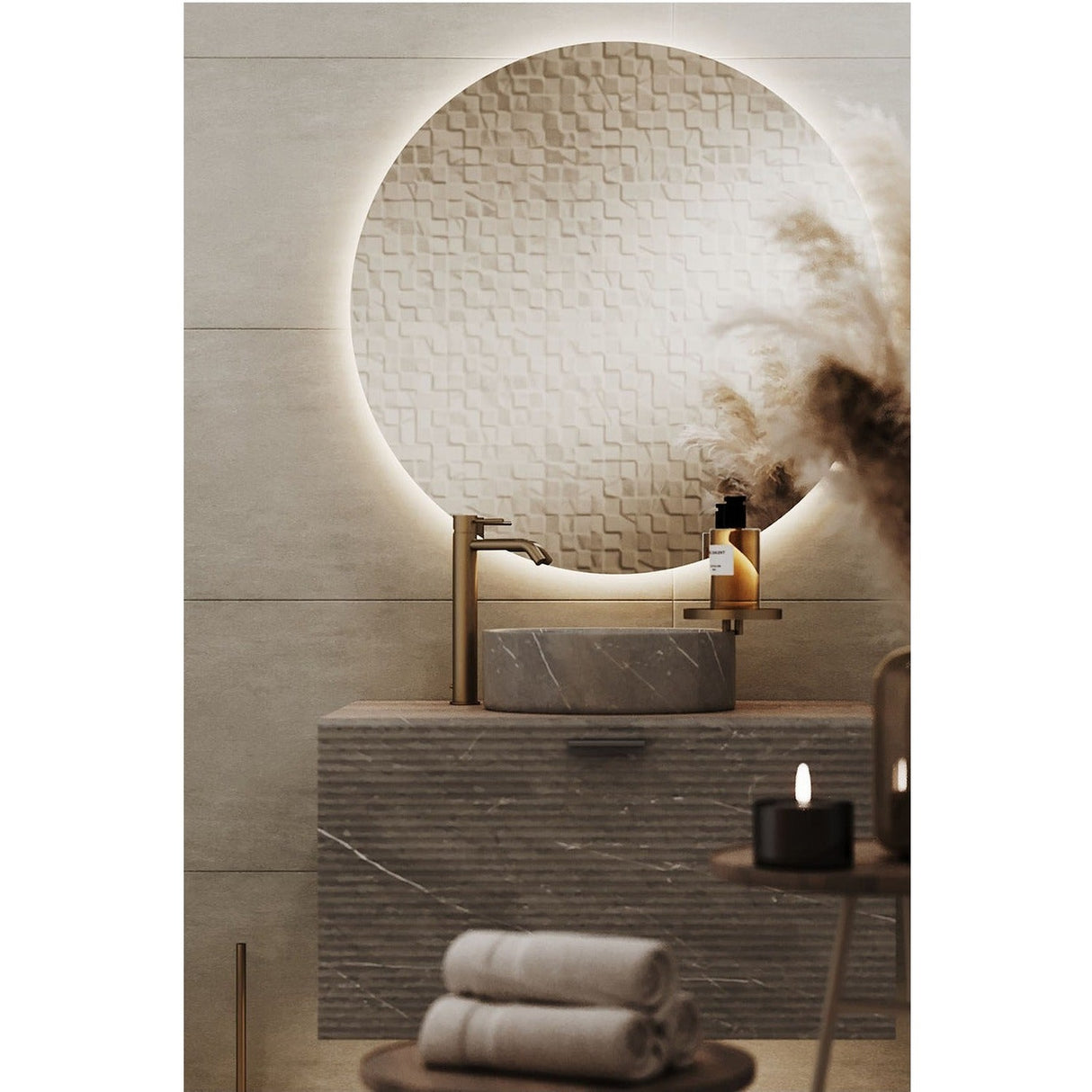 Brio Clear Round LED IP44 Bathroom Mirror above a marble countertop basin, its frameless round glass backlit with a soft ambient glow against the tiled wall.