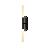 The Aurelian LED Double Column Alabaster Wall Light in matte black and soft white features two cylindrical lights at each end, offering a contemporary design perfect for modern interiors.