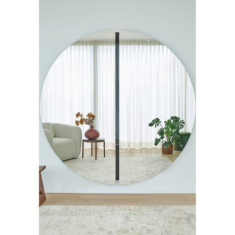 Luna Black Two Piece Round Wall Mirror 200cm, a large frameless round mirror with a black lacquered glass strip at the central join, shown reflecting a bright living room.