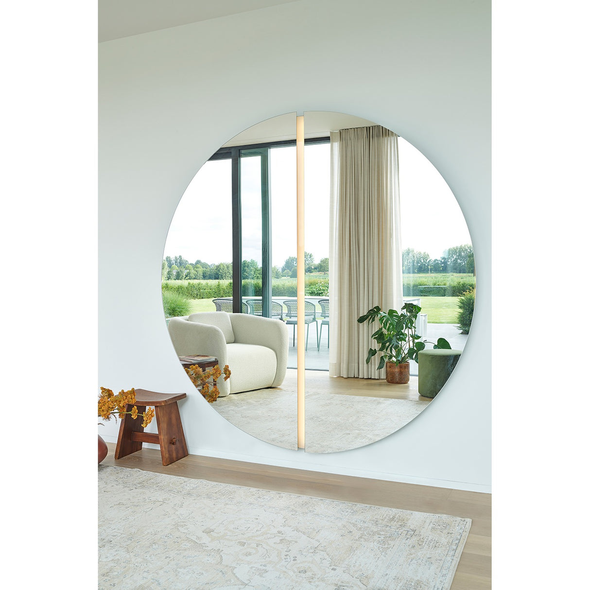 Luna Light LED Two Piece Round Wall Mirror 200cm, a large frameless circular mirror split into two halves with LED lighting along the central seam, shown on a white wall.