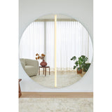 Luna Light LED two-piece round wall mirror, 200cm, frameless glass split into half-moons with a vertical LED strip lighting the central seam, reflecting a living room.