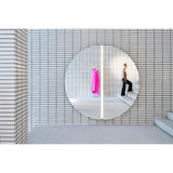 Luna Light LED Two Piece Round Wall Mirror 200cm, a large frameless round mirror split into two halves with a vertical LED strip at the centre seam, mounted on a white tiled wall.
