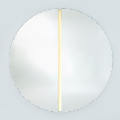 The lit round mirror seen larger, the strip running the full height of the channel that separates the halves.