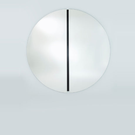 The two metre round mirror seen straight on, the black glass strip running the full height of the recessed central joint.