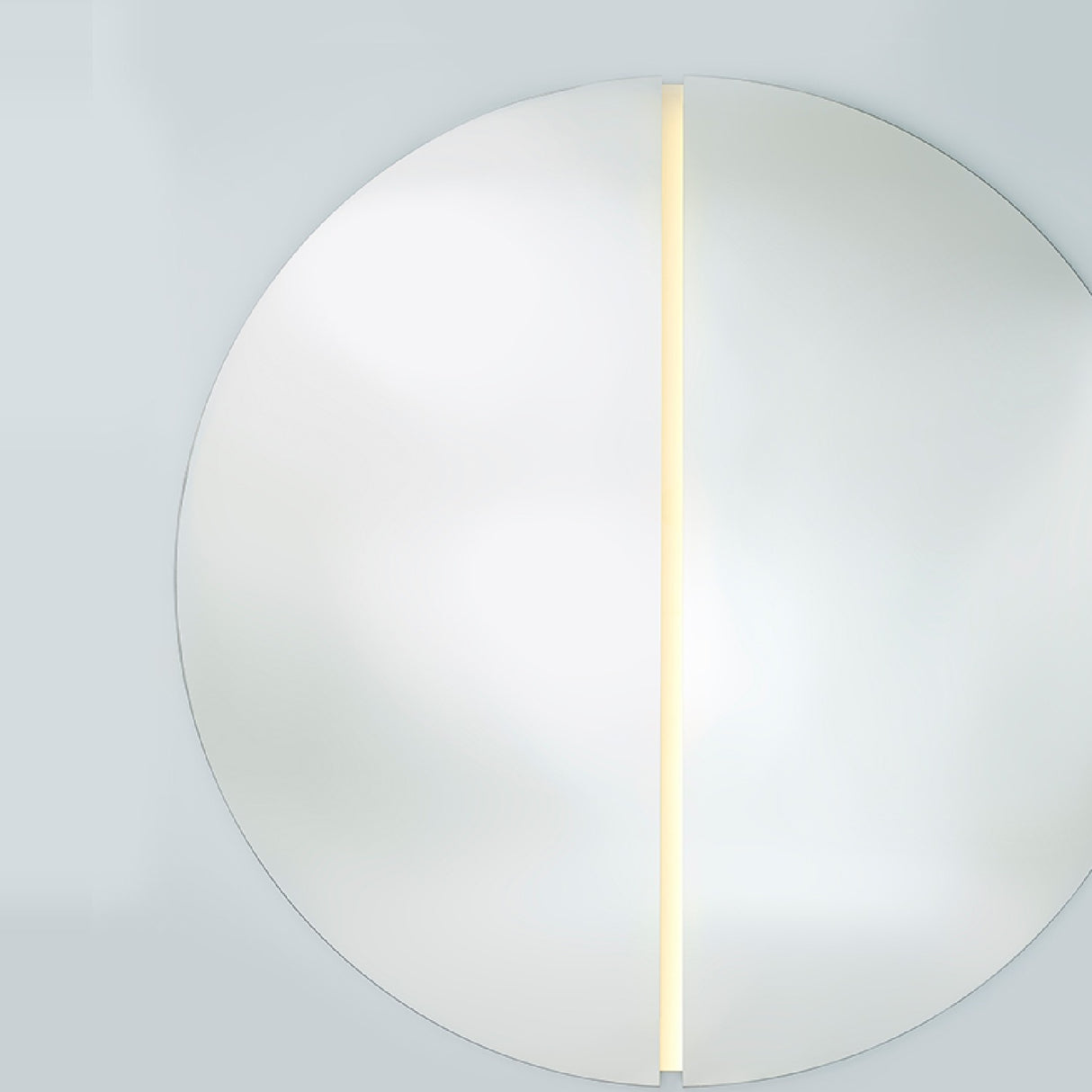 Luna Light LED Two Piece Round Wall Mirror 200cm, a frameless circular mirror split into two halves with a vertical LED strip lighting the central seam, on a plain light background.