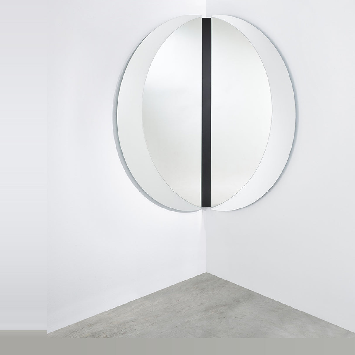 Luna Black Two Piece Corner Wall Mirror 150cm, a round frameless mirror split into two halves mounted across a room corner with a black lacquered glass strip at the join.