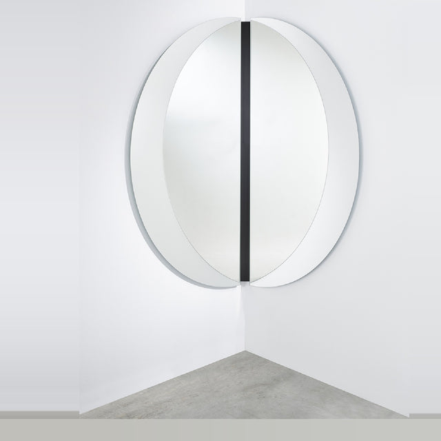 Luna Black Two Piece Corner Wall Mirror 200cm, a round frameless mirror split into two curved panels mounted at right angles with a black lacquered glass strip at the corner join.