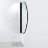 Luna Black Two Piece Corner Wall Mirror 200cm, a round frameless glass mirror in two curved panels joined by a black lacquered strip, mounted on a corner wall.