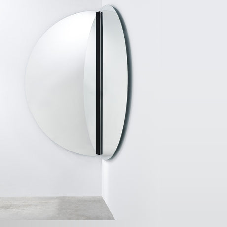 Luna Black Two Piece Corner Wall Mirror 200cm, a round frameless glass mirror in two curved panels joined by a black lacquered strip, mounted on a corner wall.