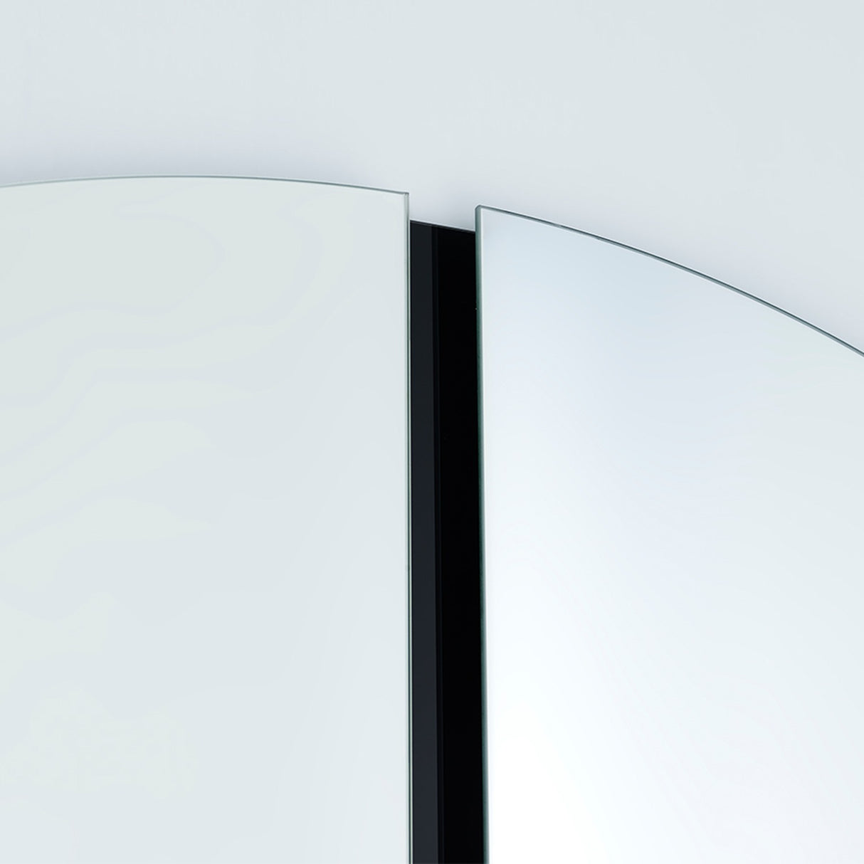 Close-up of the Luna Black Two Piece Square Wall Mirror, showing frameless glass panes separated by a black lacquered strip, against a plain light background.