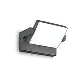 The Solstice LED Outdoor Wall Light 20.5W 3000K in Anthracite boasts a sleek square design with an anthracite metallic frame and a bright white LED panel, embodying a minimalist, contemporary style. Ideal for any white wall, it comes with an adjustable diffuser to tailor light distribution.