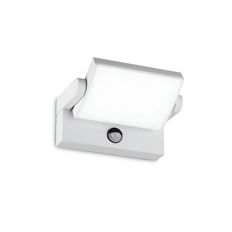 Introducing the Solstice LED Outdoor Motion Sensor Wall Light 21W 3000K in White, a modern square-shaped fixture crafted from powder-coated aluminum. Featuring a flat diffuser panel and equipped with an LED motion sensor at the bottom, its sleek design is ideal for minimalist outdoor environments.
