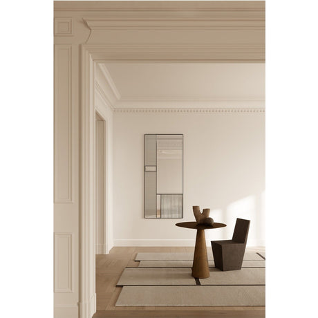 Finestra Flutes XL rectangular full-length wall mirror in a black metal frame, with fluted and plain glass panels side by side, shown in a neutral hallway setting.
