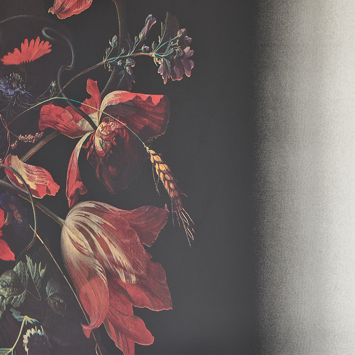 Close-up of the printed still life, red tulips and an amaryllis with a wheat ear worked in among them.