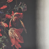Close-up of the printed still life, red tulips and an amaryllis with a wheat ear worked in among them.