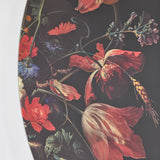 Close-up of the painted fragment, cornflowers and foliage set against the near black ground.