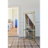Chassis XL Deluxe free standing cheval mirror, 170cm, with open gold metal frame, green marble shelf, and mirrored panel, shown in a hallway beside a staircase.