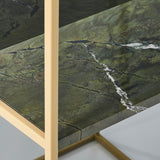 Close-up of the Chassis XL Deluxe free standing mirror's green marble shelf with white veining, set within an open gold metal frame.