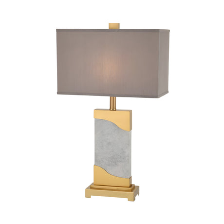 The Torvani 1 Light Statement Marble Table Lamp features a rectangular grey shade, a brass and marble-patterned rectangular base, and gold accents on the base and stand, set against a white background.