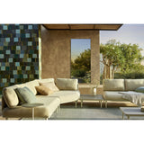 Lucka Outdoor XXL full length garden mirror, 200cm rectangular black metal frame, mounted on a stucco wall in an outdoor patio setting reflecting trees and sky.