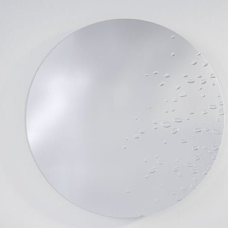 Matin Hand Applied Dewdrop Round Wall Mirror 60cm, a frameless round glass mirror with raised dewdrop details clustered across the lower right edge, shown against a plain light grey background.