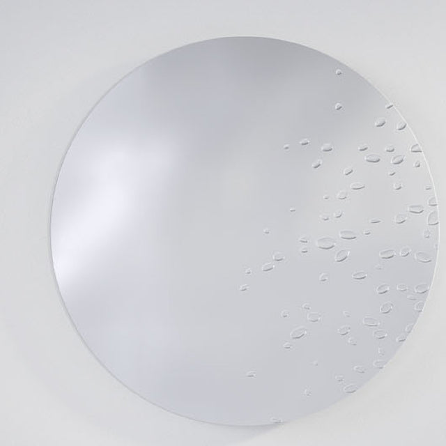 Matin Hand Applied Dewdrop Round Wall Mirror 60cm, a frameless round glass mirror with raised dewdrop details clustered across the lower right edge, shown against a plain light grey background.