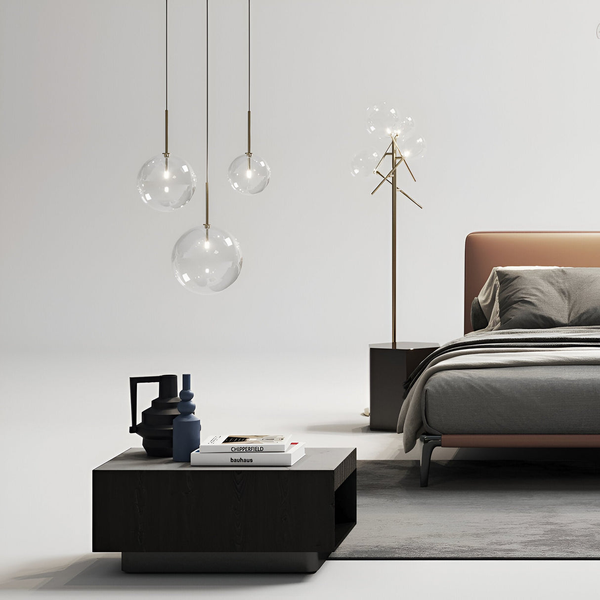 A modern bedroom showcases a brown upholstered bed with gray bedding. A dark wooden nightstand, adorned with decorative vases and books, is complemented by elegant pendant lights. The Solarae Floor Lamp - Brass, featuring an antique brass finish and clear blown glass diffusers, stands nearby.