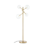 Introducing the Solarae Floor Lamp - Brass: a modern masterpiece with an elegant antique brass finish and asymmetrical blown glass diffusers on its sleek stand. The design features a circular base and a discreet black power cord, combining style with functionality.