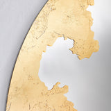 Close-up of the Ornato Gold Leaf Round Rotating Wall Mirror 70cm, showing hand-applied gold leaf with a torn, irregular edge against the plain mirror surface.
