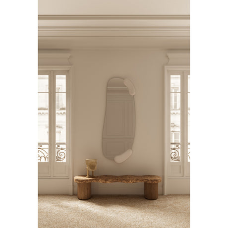 Calco Sculpted Full Length Wall Mirror 166cm in white, with an irregular arched glass and two moulded white forms at top and bottom, shown mounted in a hallway above a wooden bench.