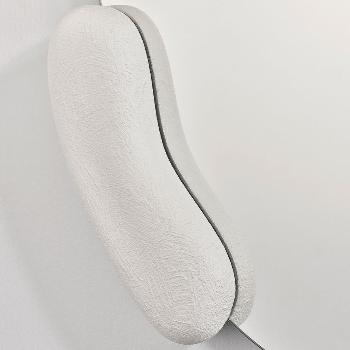 Calco White Sculpted Round Wall Mirror 73cm, close-up of the hand-finished white composite form with visible brush texture, shown against a plain white background.