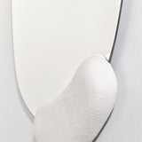 Close-up of the lower moulded form where it meets the glass, the brush marks left visible in the finish.