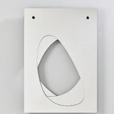 White rectangular Infinito Precision Cut Void Wall Mirror, 100cm, with black-outlined organic cut-out revealing layered mirrors behind, shown on a plain light background.