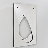 Infinito Precision Cut Void Wall Mirror 100cm, a rectangular frameless mirror with a white panel and an organic cut-out void revealing recessed mirrored glass, shown at an angle against a plain wall.