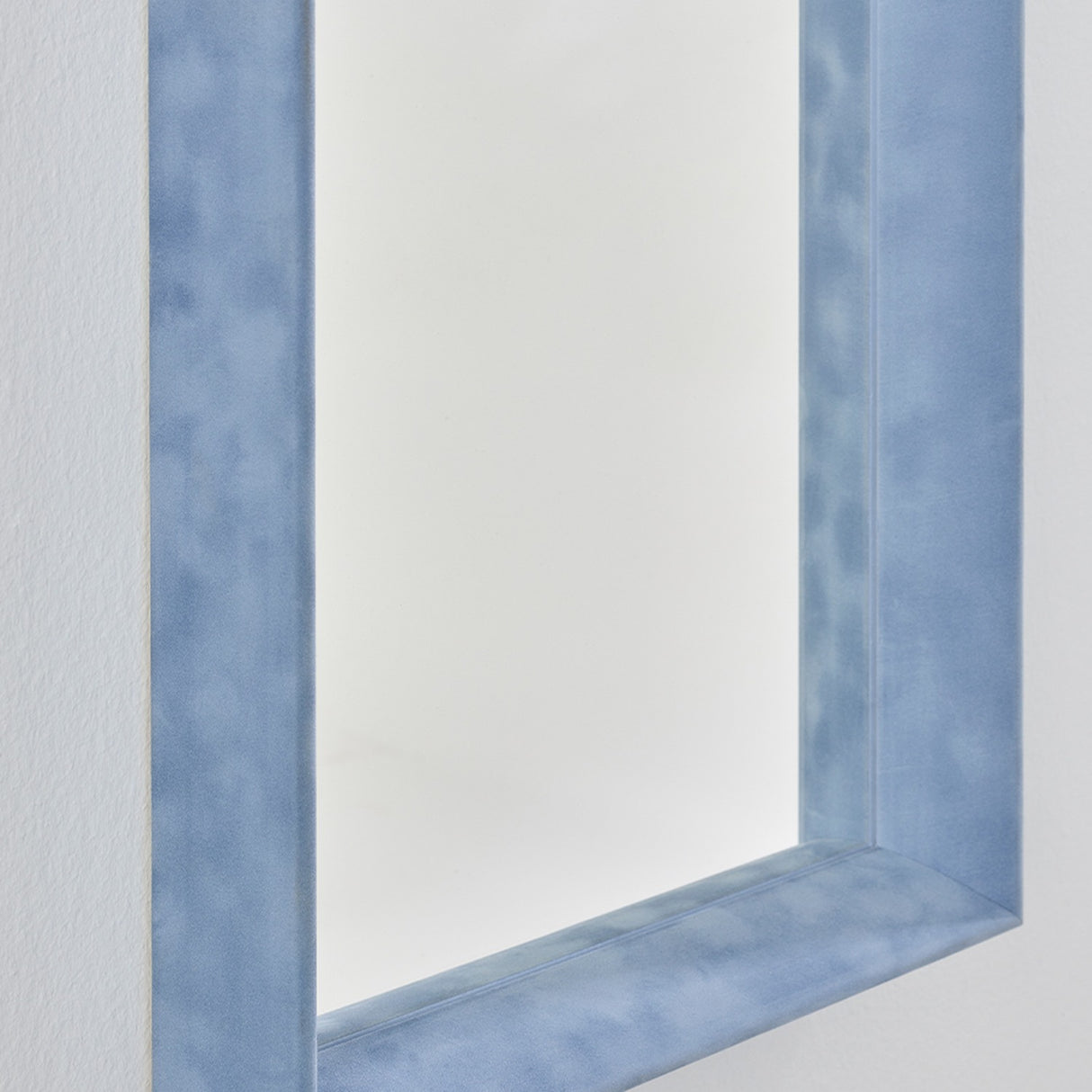 Close-up of the Velvet Blue Framed Rectangular Wall Mirror 150cm, showing the deep box frame in dusty blue velvet with recessed glass and visible inner return.