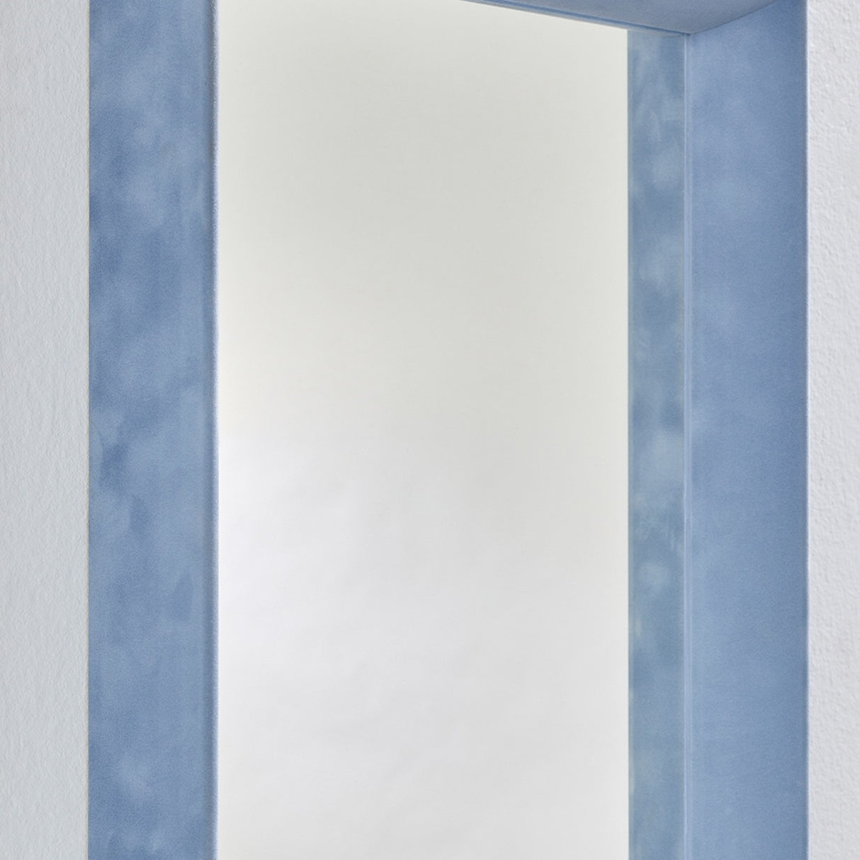 Close-up of the Velvet Blue Framed Rectangular Wall Mirror, 150cm, showing the deep box frame in dusty blue velvet with the recessed glass and shaded inner return.
