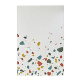 Rectangular frameless wall mirror, 120cm, with terrazzo-style chips in red, teal, ochre and grey printed along the lower edge, plain mirrored glass above, on a white background.